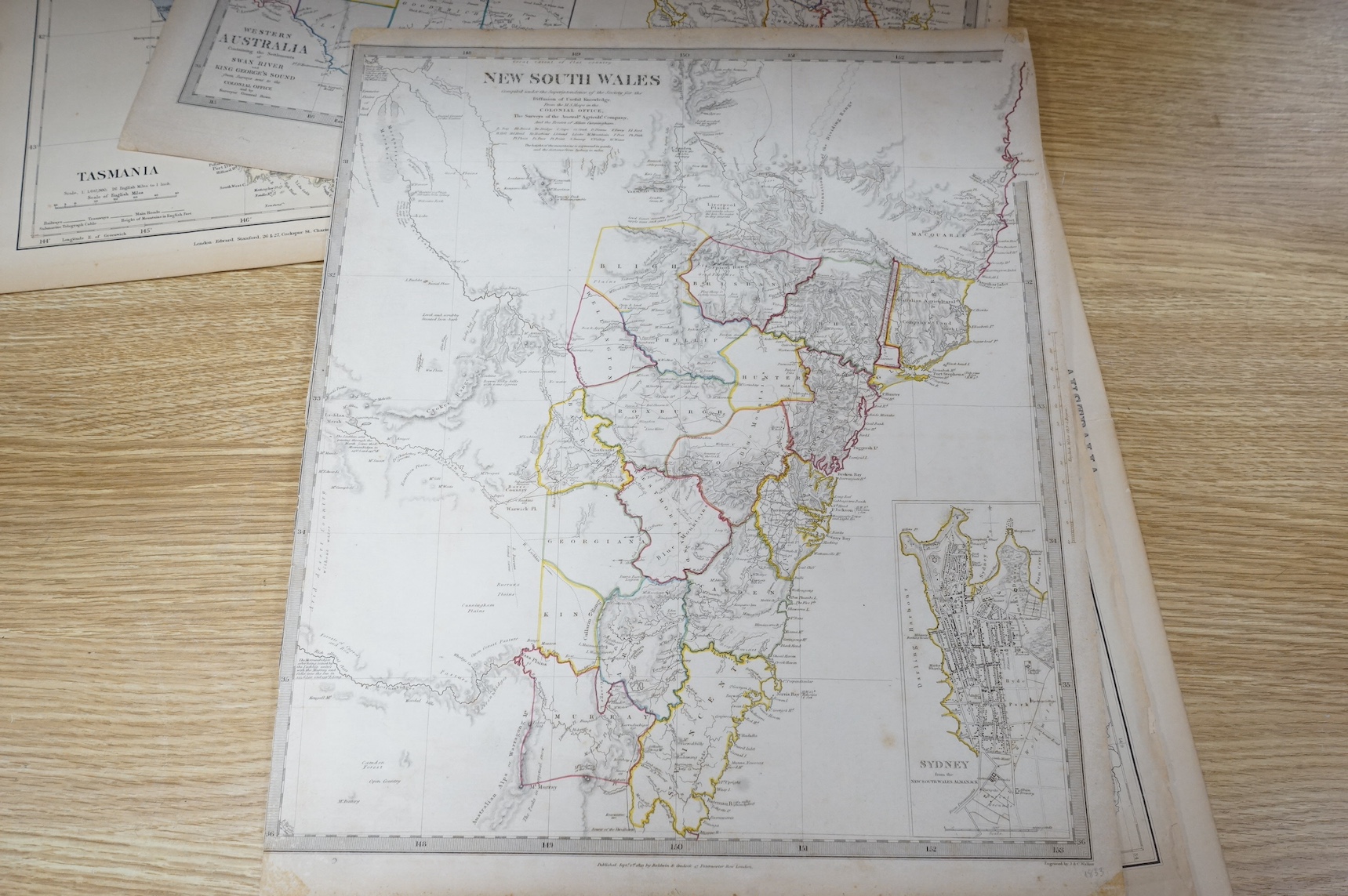 A collection of 19th century engraved maps to include Western Australia, Tasmania and New South Wales, unframed, largest 42 x 35cm. Condition - some foxing and discolouration